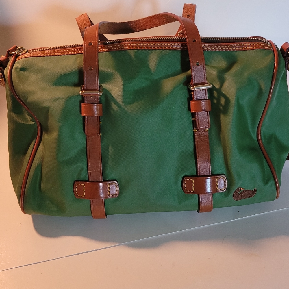 Dooney and Bourke purse. Green with Pink interior. Great condition.